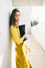 outfit with black clutch bag yellow skit in velvet